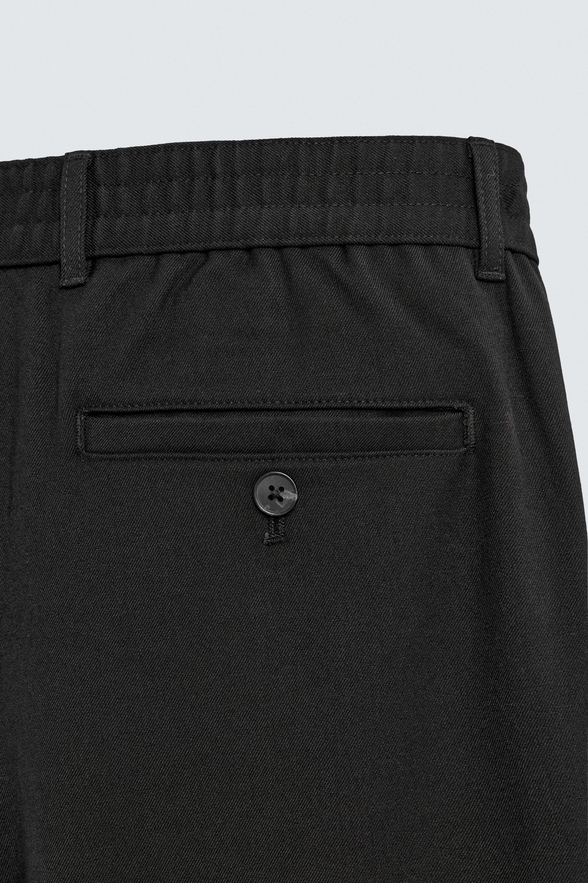 TEXTURED PLEATED PANTS